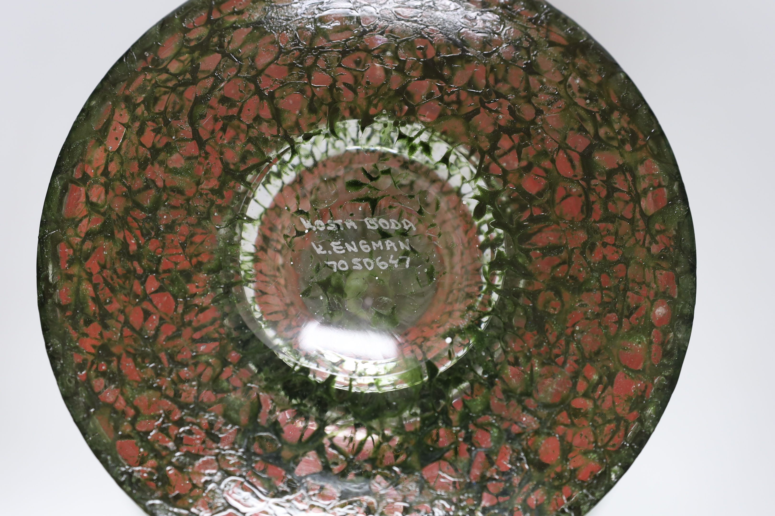 A Kosta Boda orange and green glass pedestal bowl, signed KOSTA BODA / K. ENGMAN 7050647, 26cm high
